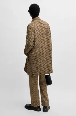 Houndstooth-check coat with concealed closure