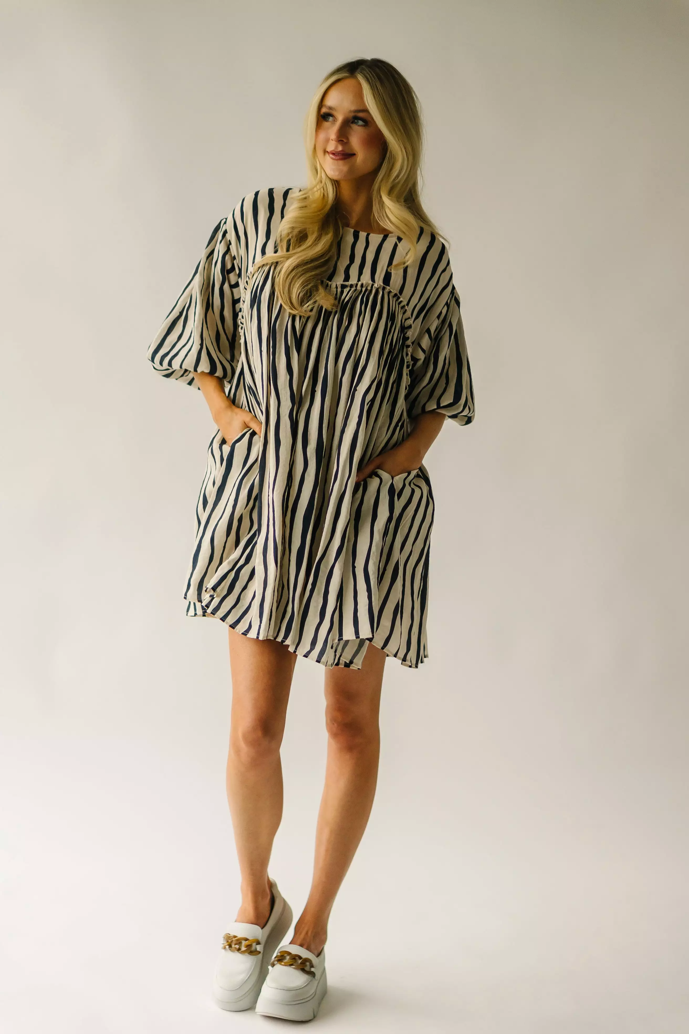 The Pampa Bubble Sleeve Babydoll Dress in Navy Stripe